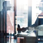 Shot of two businessmen shaking hands in an office